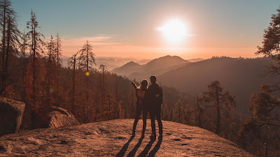 Couple in love watching the sunset together