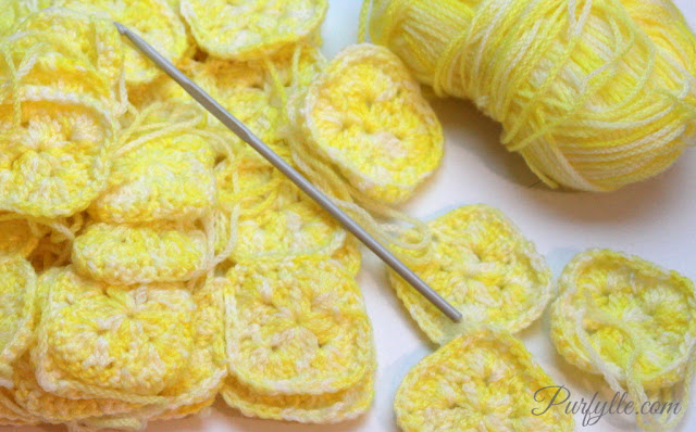 Crochet granny squares in lemon variegated yarn