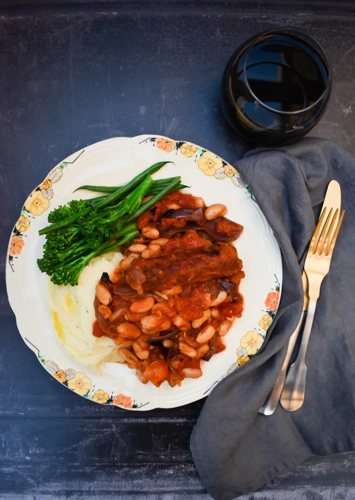 veggie sausage and white bean stew served up with creamy mashed potatoes, green beans and broccoli