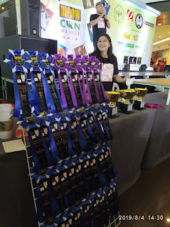 Racks of award ribbons during Meowcon 2019 Racks of award ribbons during Meowcon 2019 made by Letra 'To Arts and Crafts