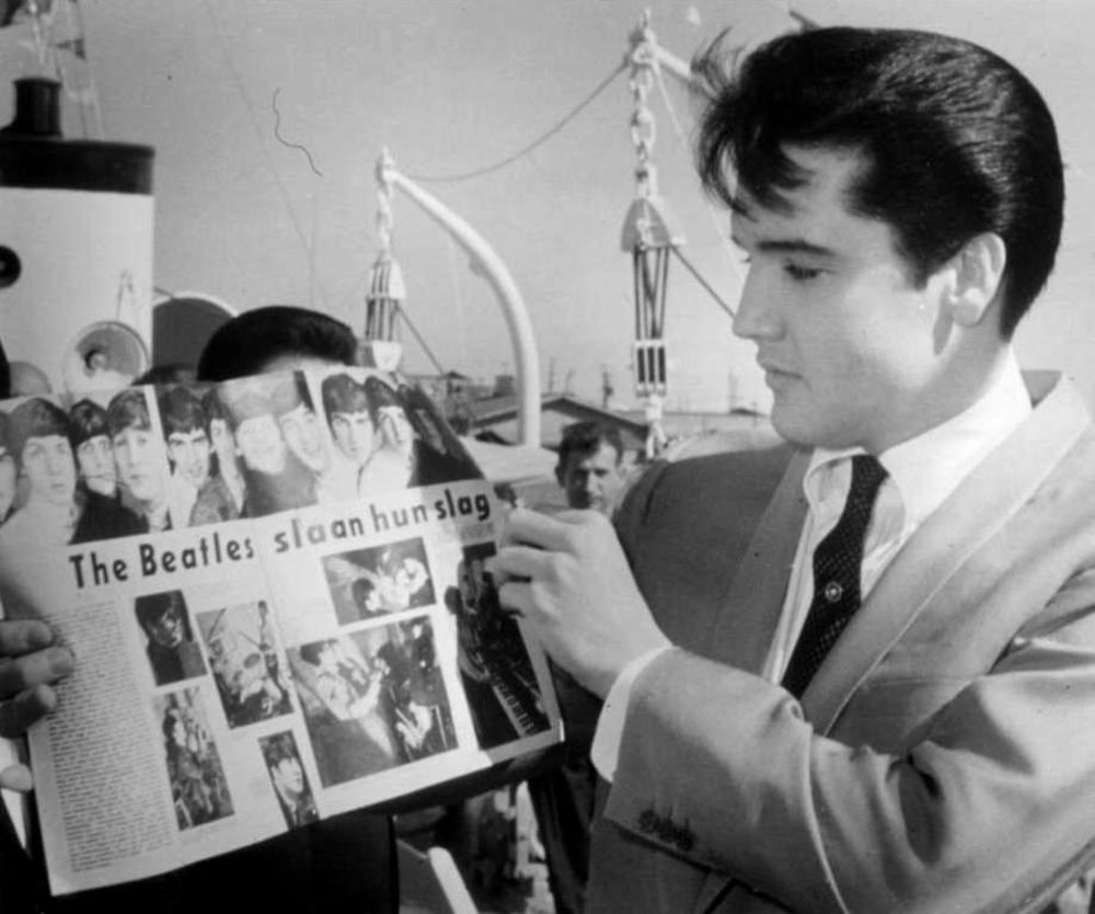 Elvis Presley Holding Muziek Expres Magazine and Showcasing the Beatles