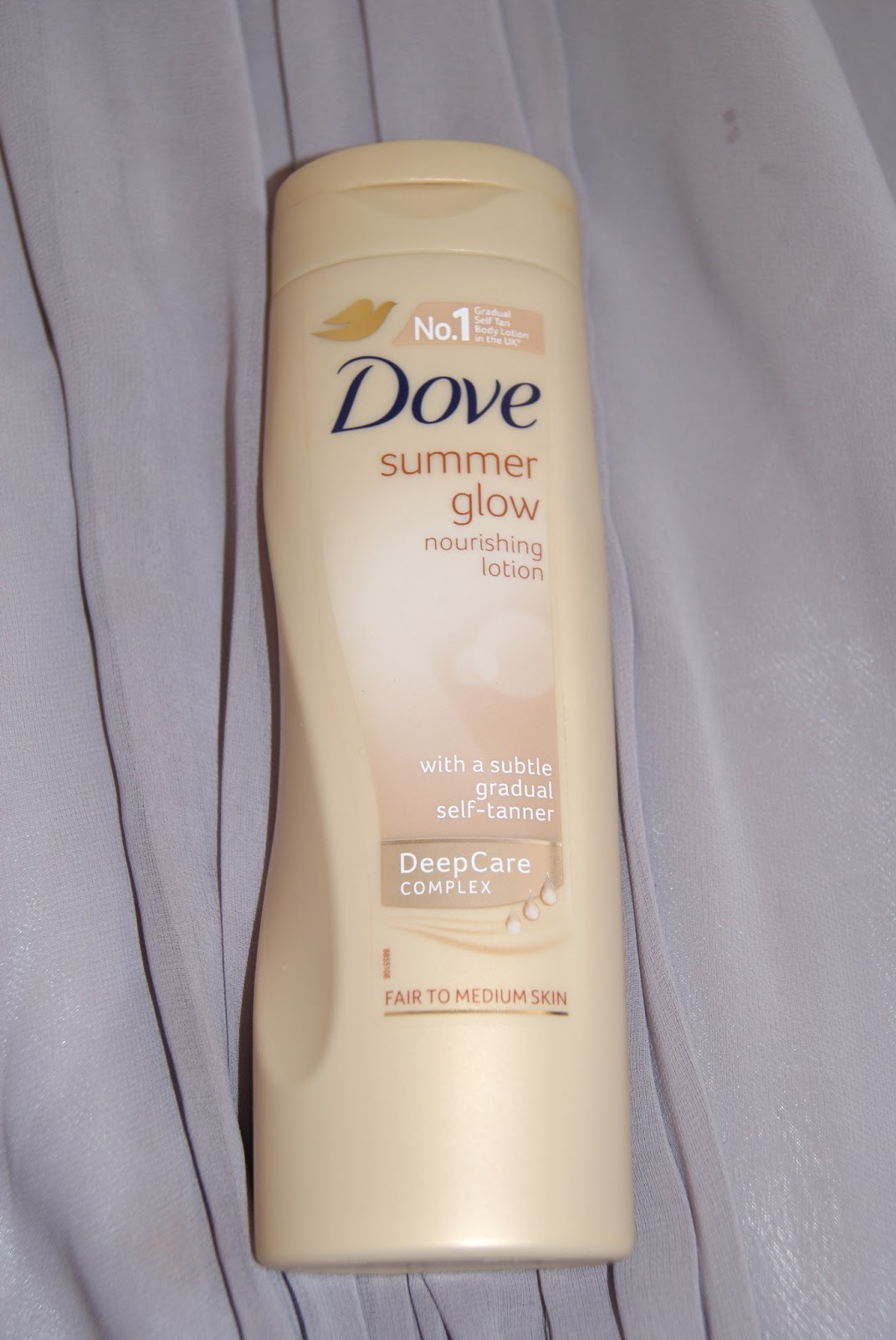 applying dove gradual tan