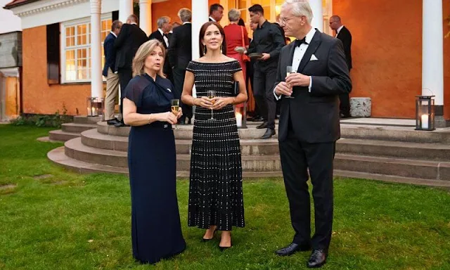 Crown Princess Mary wore a synthetic off-shoulder knit dress by Alexander McQueen. Jewlscph earrings. Cartier diamond bracelet