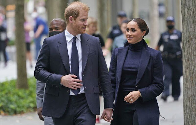 Meghan Markle wore a high-neck sweater with trousers underneath a long coat