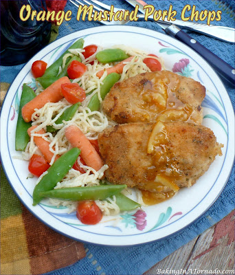 Orange Mustard Pork Chops, lightly marinated, crusted, oven “fried” pork chops served with a sweet hot citrus sauce. | recipe developed by www.BakingInATornado.com | #recipe #dinner