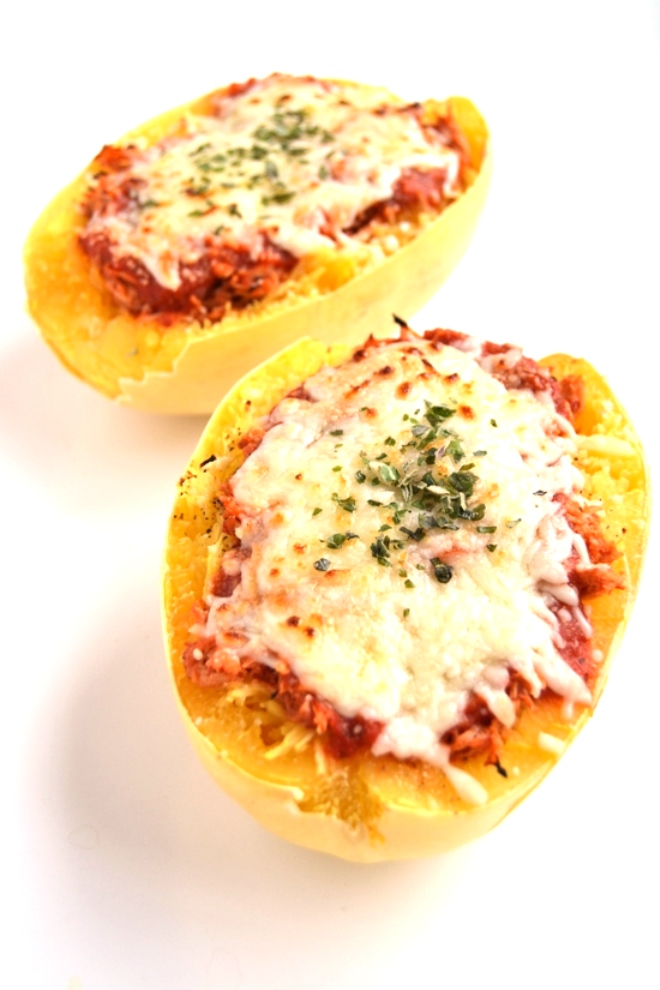 Chicken Parmesan Stuffed Spaghetti Squash is a much healthier but still delicious version of your favorite chicken parm. The chicken is cooked in the slow cooker to make it easy! www.nutritionistreviews.com