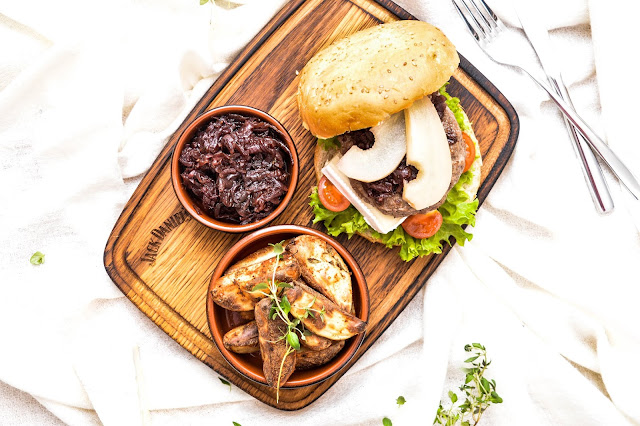 Exquisite beef burger with marinated pear and red onion marmalade