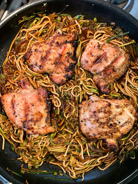 Check thighs atop chow mein and zucchini noodles