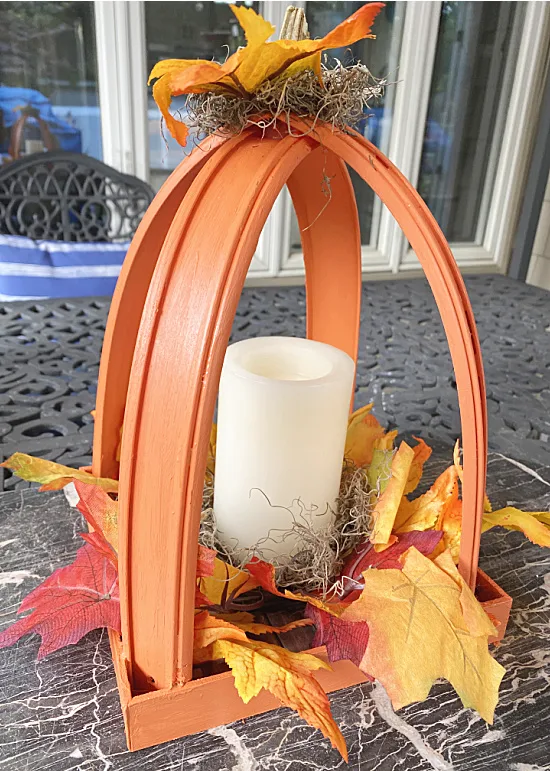 pumpkin lantern on outdoor table