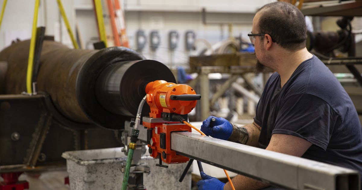 The Civil War Picket USS Monitor Center cleans the inside of one of