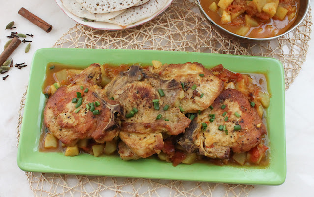 Food Lust People Lust: In this Indian-Spiced Pork Chop Potato Skillet you cook the chops till tender in a spicy tomato-onion sauce. Add potatoes and you have a full meal in one pan.