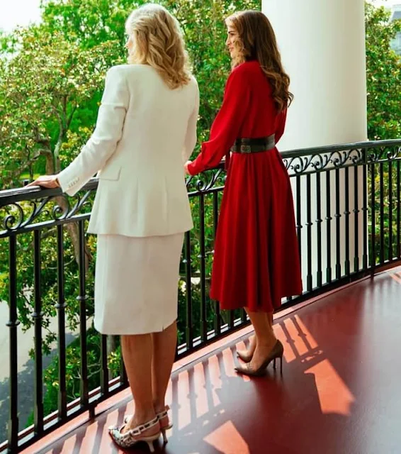 Queen Rania wore a red dress by Hussein Bazaza. First Lady Jill Biden wore J'Adior cotton slingback pumps by Dior