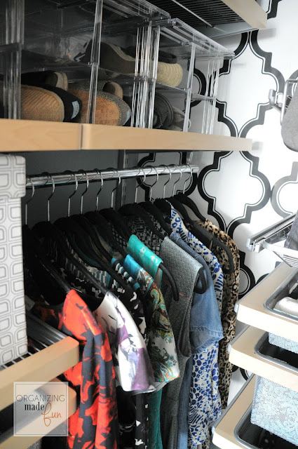 Pop of wallpaper and clear shoe storage in the master closet :: OrganizingMadeFun.com