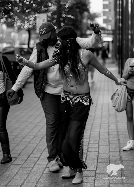 Belly dancer with a passerby.