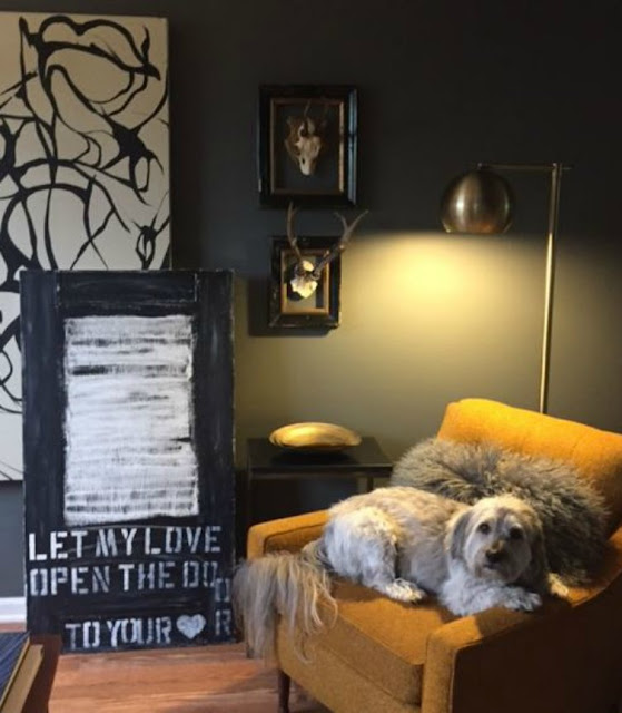 Painting by Michele of Hello Lovely in Midcentury living room with orange chair