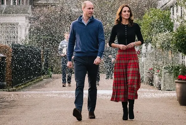 Kate Middleton wore Emilia Wickstead tartan pleated skirt. The Duchess wore a new cashmere cardigan by Brora