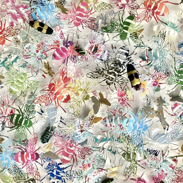 square collage of paper cut butterflies and dragonflies layered with beetles