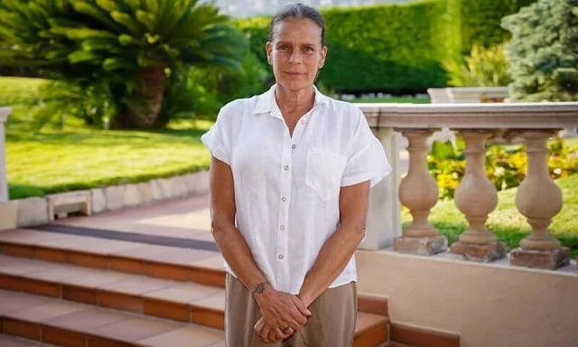 Princess Stephanie wore white linen shirt and Tory Burch high-waisted wide leg trousers