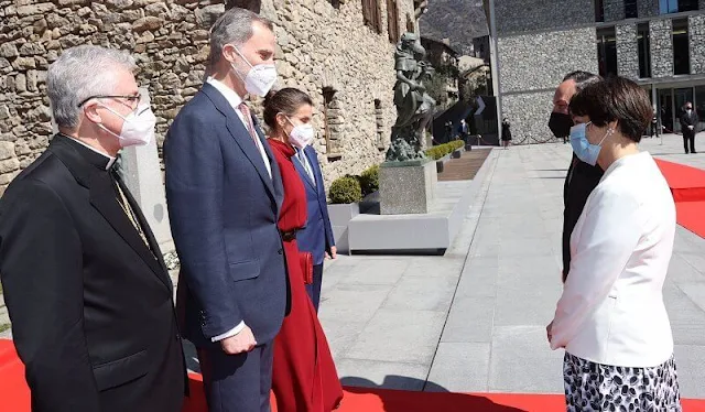 Queen Letizia wore a limited edition burgundy red open back dress from Massimo Dutti