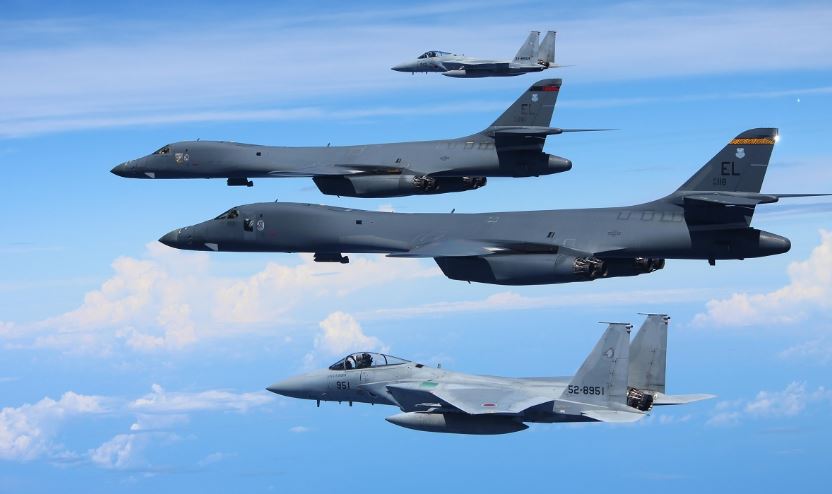 Military and Commercial Technology: Two B-1B Lancers train with 16