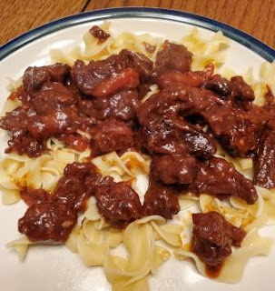 Picture of noodles with beef recipe on top