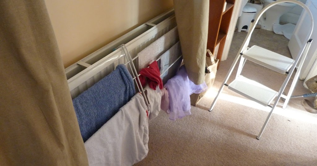 An English Homestead Drying Clothes In Winter