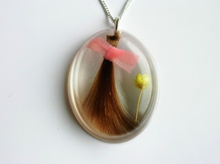 Hair and yellow flower keepsake pendant