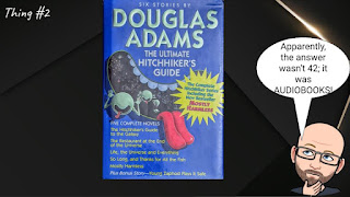 A slide with the cover to The Hitchhiker's Guide to the Galaxy on it, along with a cartoon-version of Lance saying "Apparently, the answer wasn’t 42; it was AUDIOBOOKS!".