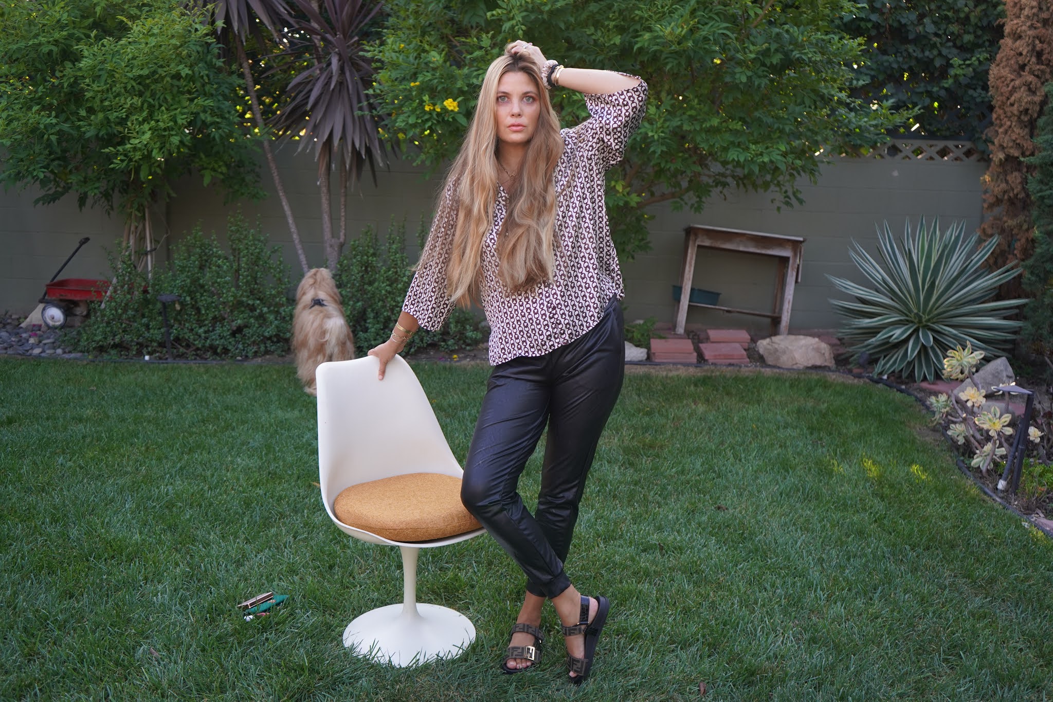 woman leaning on a chair