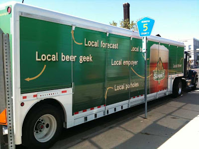 More labels on the truck, Local Beer Geek at the back, Local Employer, Local Forecast pointing to roof of truck, Local Potholes, pointing at ground