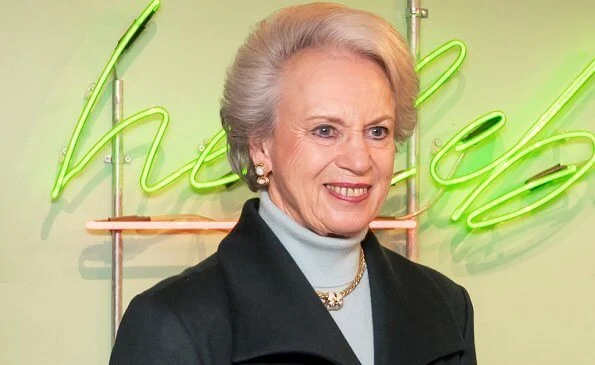 Princess Benedikte wore a green wool cashmere coat, and blue cashmere sweater, and gold diamond necklace. The Princess wore black leather boots