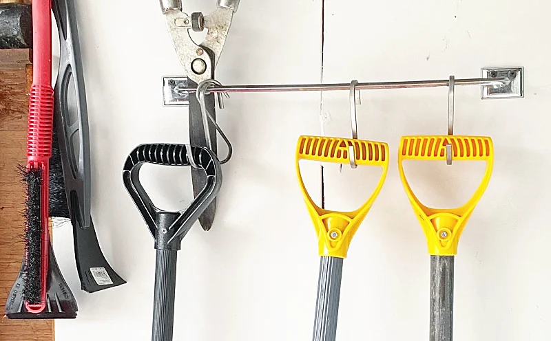 tools hanging on a towel bar