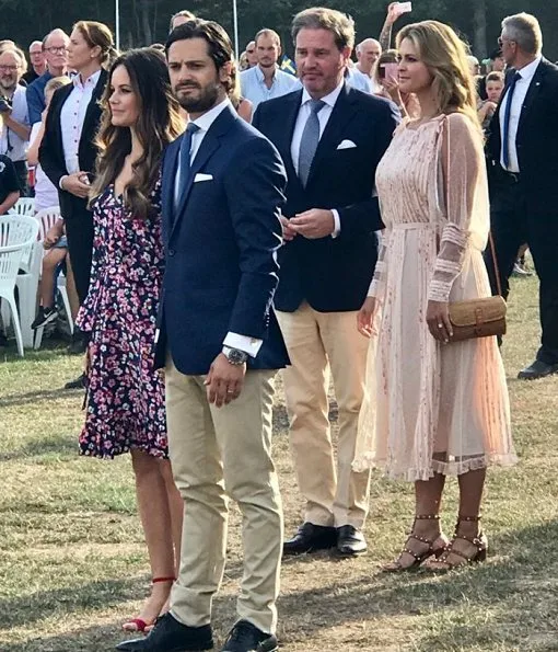 Princess Madeleine wore RED Valentino Natural Pleated Tulle Floral Print Midi Dress and Princess Sofia wore & Other Stories Tie Frill Dress. Princess Estelle