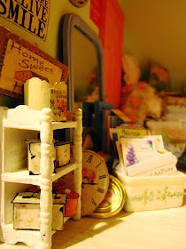 Modern miniature shabby chic shop close up with display shelves, wall pictures and sot furnishings.