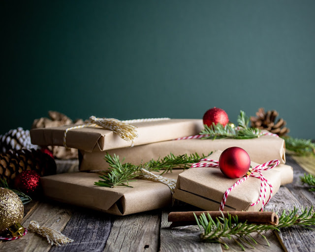 gifts wrapped in Christmas seasonal wrapping | Top Tips To Make Help Christmas Preparations Easier