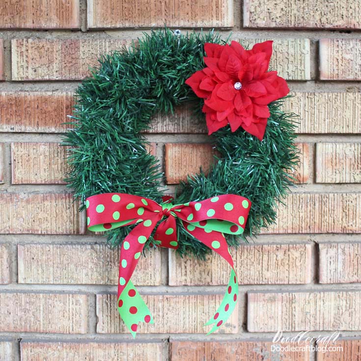 Make a darling holiday wreath in less than 30 minutes with a few simple supplies from the Dollar Tree.