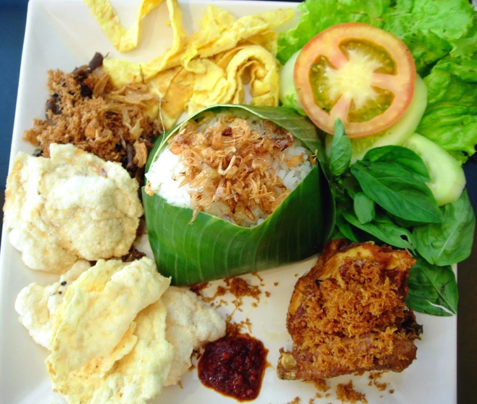 Nasi Uduk with traditional Indonesian side dishes