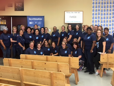 Group shot of faculty team at Feed My Starving Children