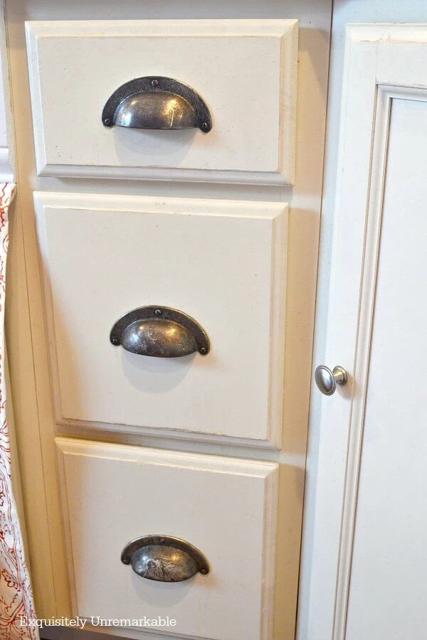 Bisque Kitchen Drawers With Traditional Silver Cup Pulls