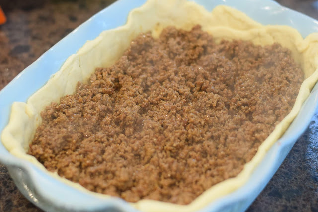 The taco meat in the baking dish. 