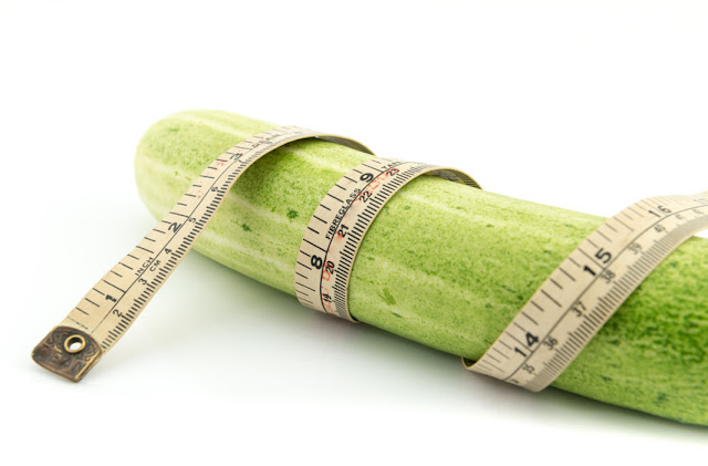 Long cucumber and measuring tape