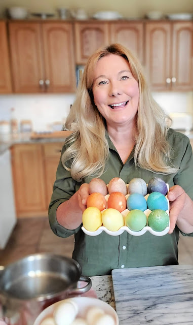 woman holding carton of Easter eggs