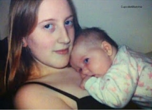 A photo of myself, a white, female teen wearing a black vest top with Midge as a baby in a white and pink baby gro lays on my chest.
