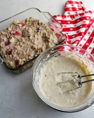pan of strawberry baked oatmeal batter and mixing bowl filled with cream cheese filling ready to be mixed and baked