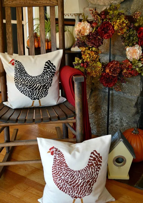 Hand Stenciled Rooster Or Chicken Pillows on a rocking chair