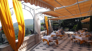 The Hotel Scapolatiello's elegant dining terrace overlooks beautiful countryside