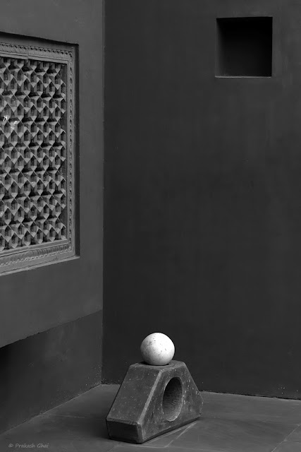 A Black and White Minimal Art Photograph of a White Ball placed on a Sculpture at Jawahar Kala Kendra.