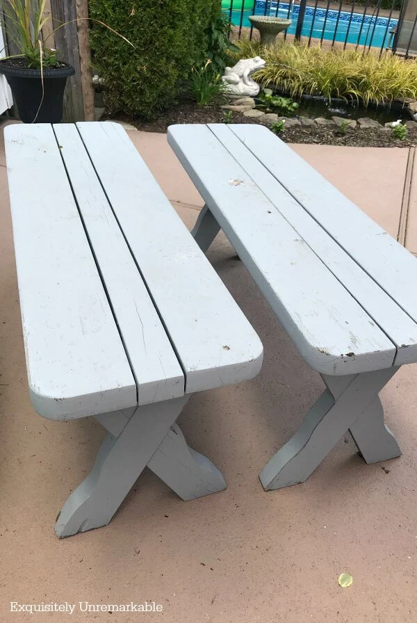 Two Wooden Picnic Benches In the garden