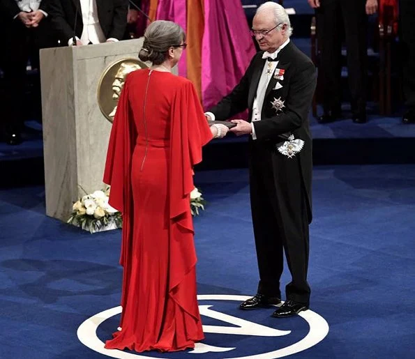 Queen Silvia, Prince Daniel, Prince Carl Philip. Princess Sofia wore a red dress. Crown Princess Victoria wore her mother's gown