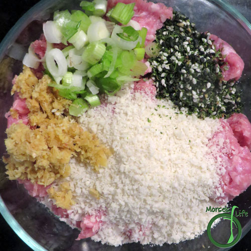 Morsels of Life - Pork Meatball Ramen Step 3 - Meanwhile, combine pork, panko, half the ginger, furikake, and green onions, mixing until homogeneous.
Form into meatballs, and heat them in a bit of oil until cooked through.